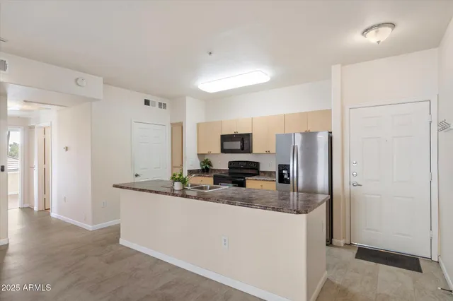 a kitchen that has a sink and a stove