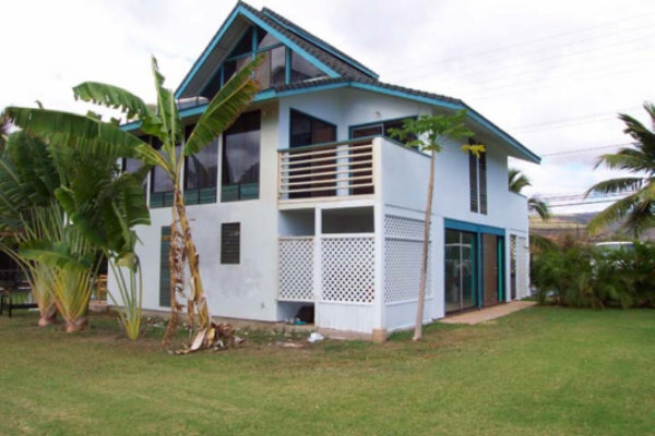 8582 Elepaio Road Kekaha, HI 96752 - Photo 2 of 6 a view of a house with a yard