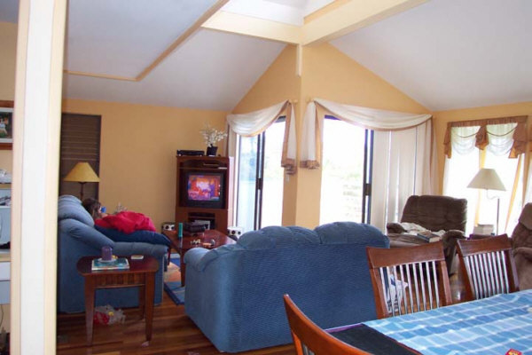 8582 Elepaio Road Kekaha, HI 96752 - Photo 3 of 6 a view of a dining room with furniture and window