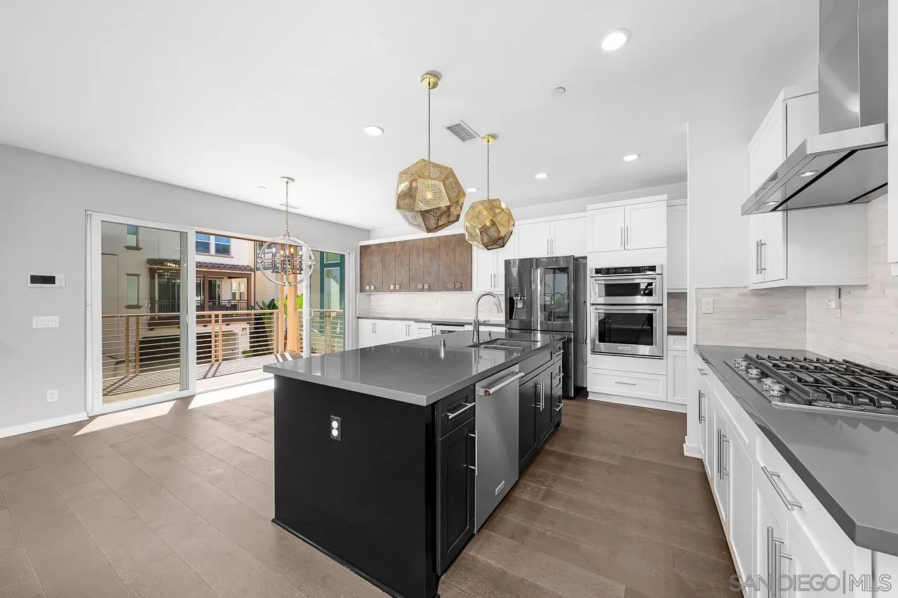 8352 Ridge Court San Diego, CA 92108 - Photo 12 of 68 a kitchen with stainless steel appliances granite countertop a stove and a sink