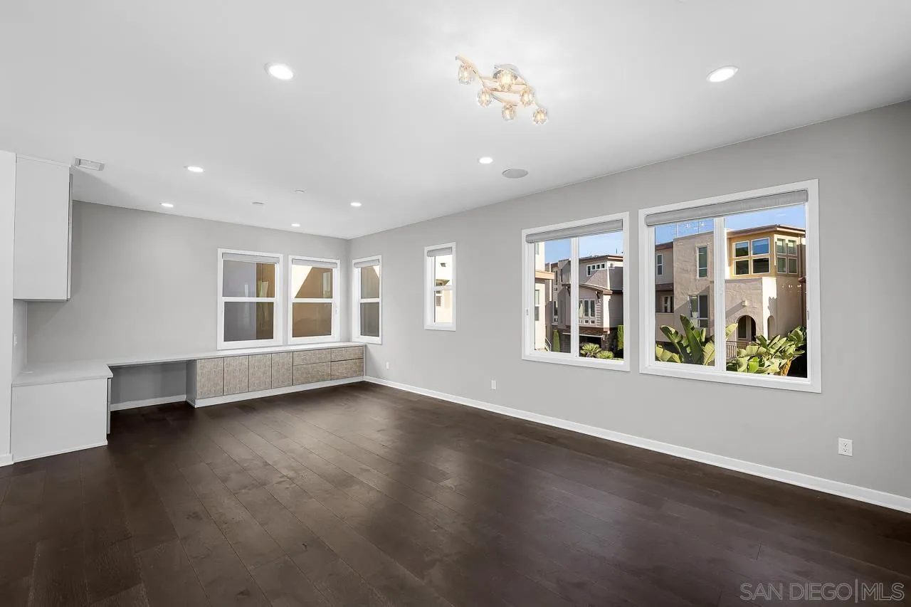 8352 Ridge Court San Diego, CA 92108 - Photo 18 of 68 a view of an empty room with wooden floor and a window
