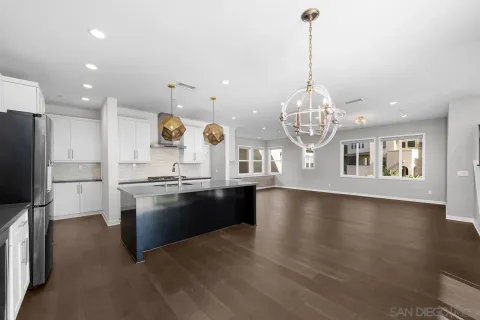 a kitchen with stainless steel appliances granite countertop a stove and a sink