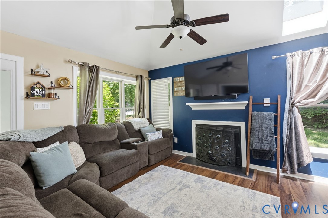 5613 Woods Walk Road Midlothian, VA 23112 - Photo 5 of 28 The living room has a wood burning fireplace.