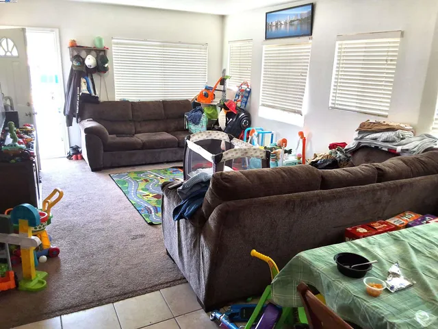 a kitchen with a sink a stove and a microwave