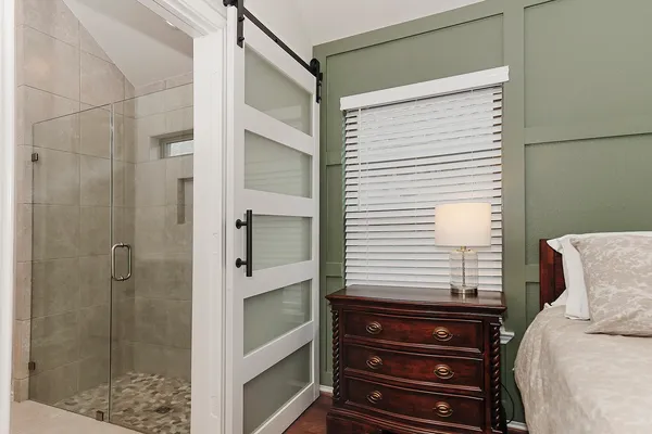 a bathroom with a bathtub and shower