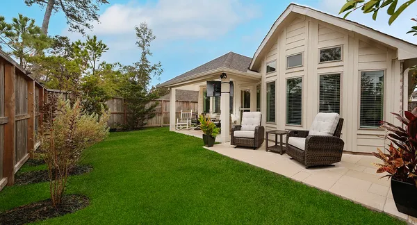 a front view of a house with a garden and porch