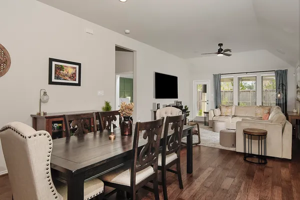 a view of a dining room with furniture and wooden floor