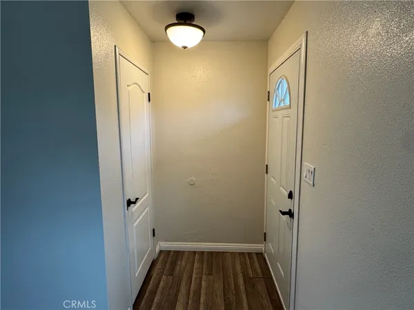 a view of a room with wooden floor and sink