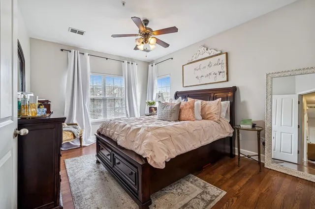 a bed room with a bed and a chandelier