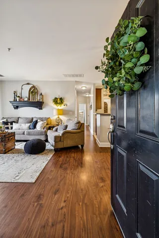 a living room with furniture and a potted plant