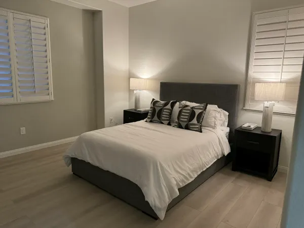 a bedroom with a bed and window