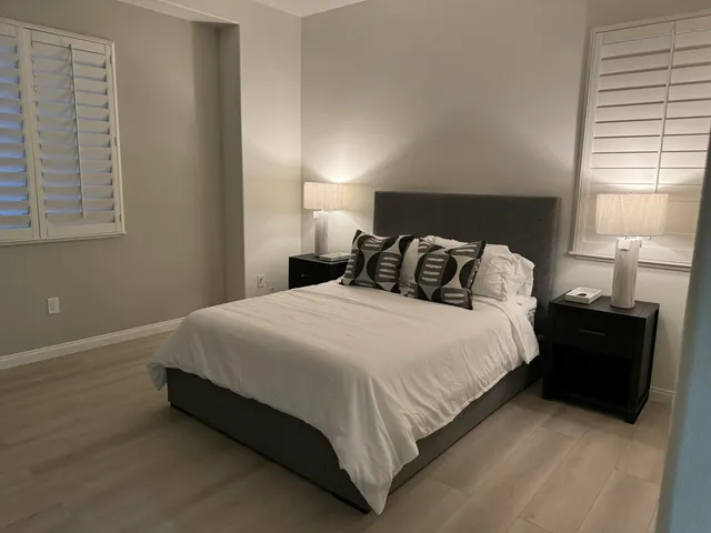 a bedroom with a bed and window