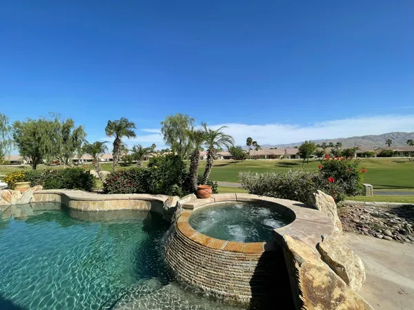 a view of a swimming pool and lake view