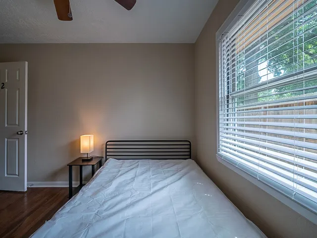 a view of wooden floor and windows in a room