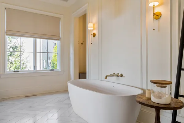 a bathroom with a tub and shower