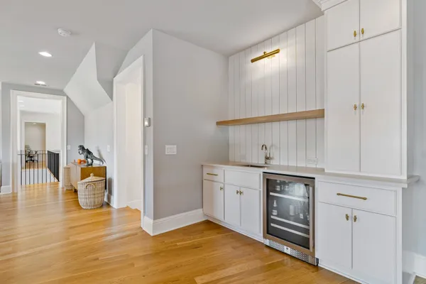 a kitchen that has a sink and a stove in it