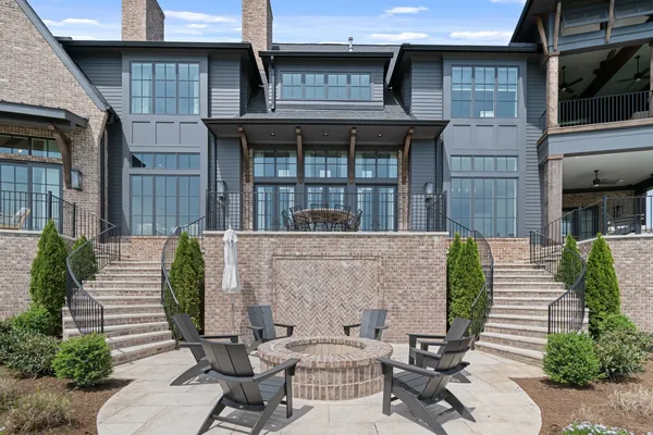 a view of a patio with table and chairs and potted plants