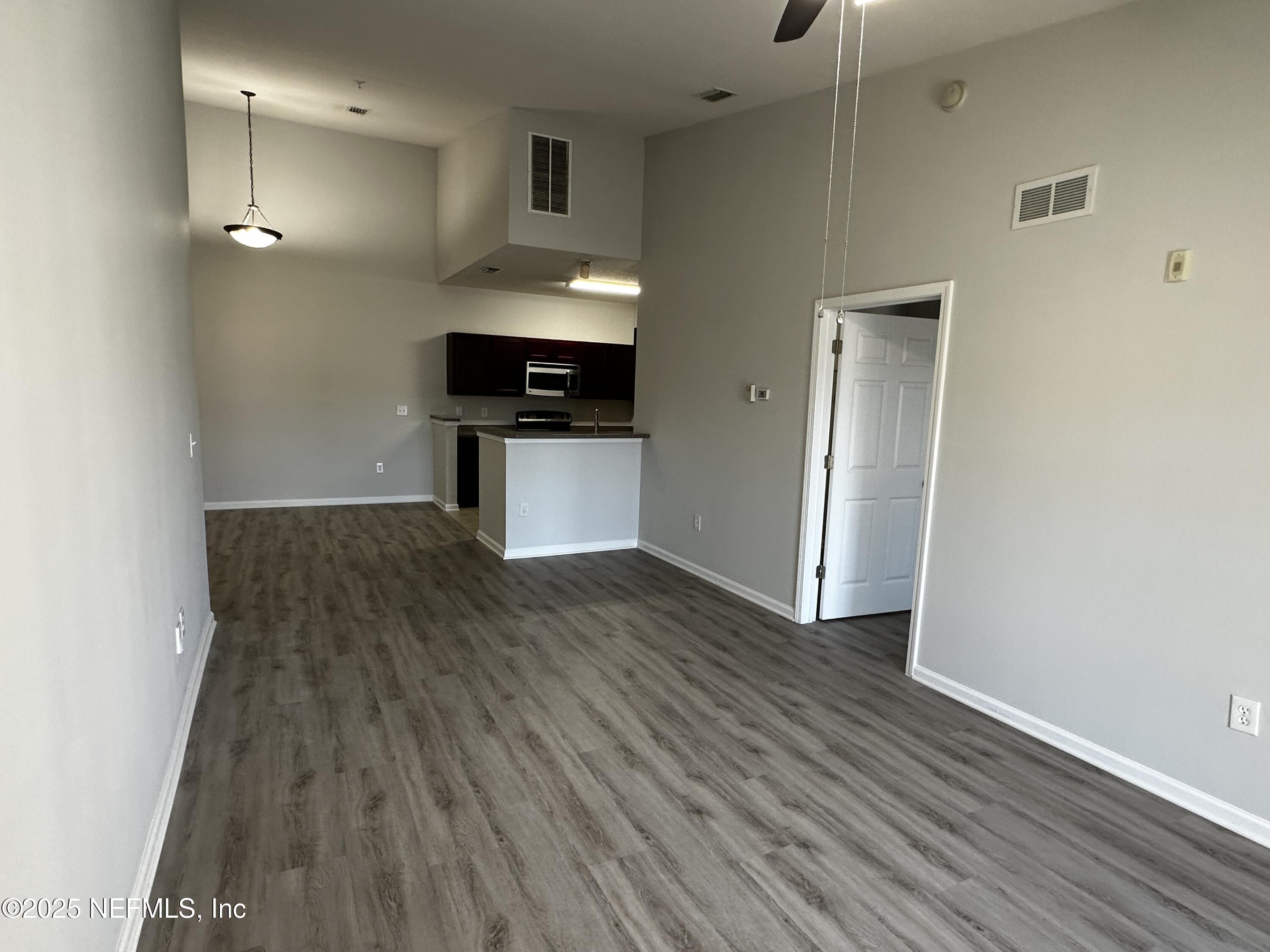 4917 Key Lime Drive, Unit 306 Jacksonville, FL 32256 - Photo 11 of 51 a view of kitchen with sink and wooden floor