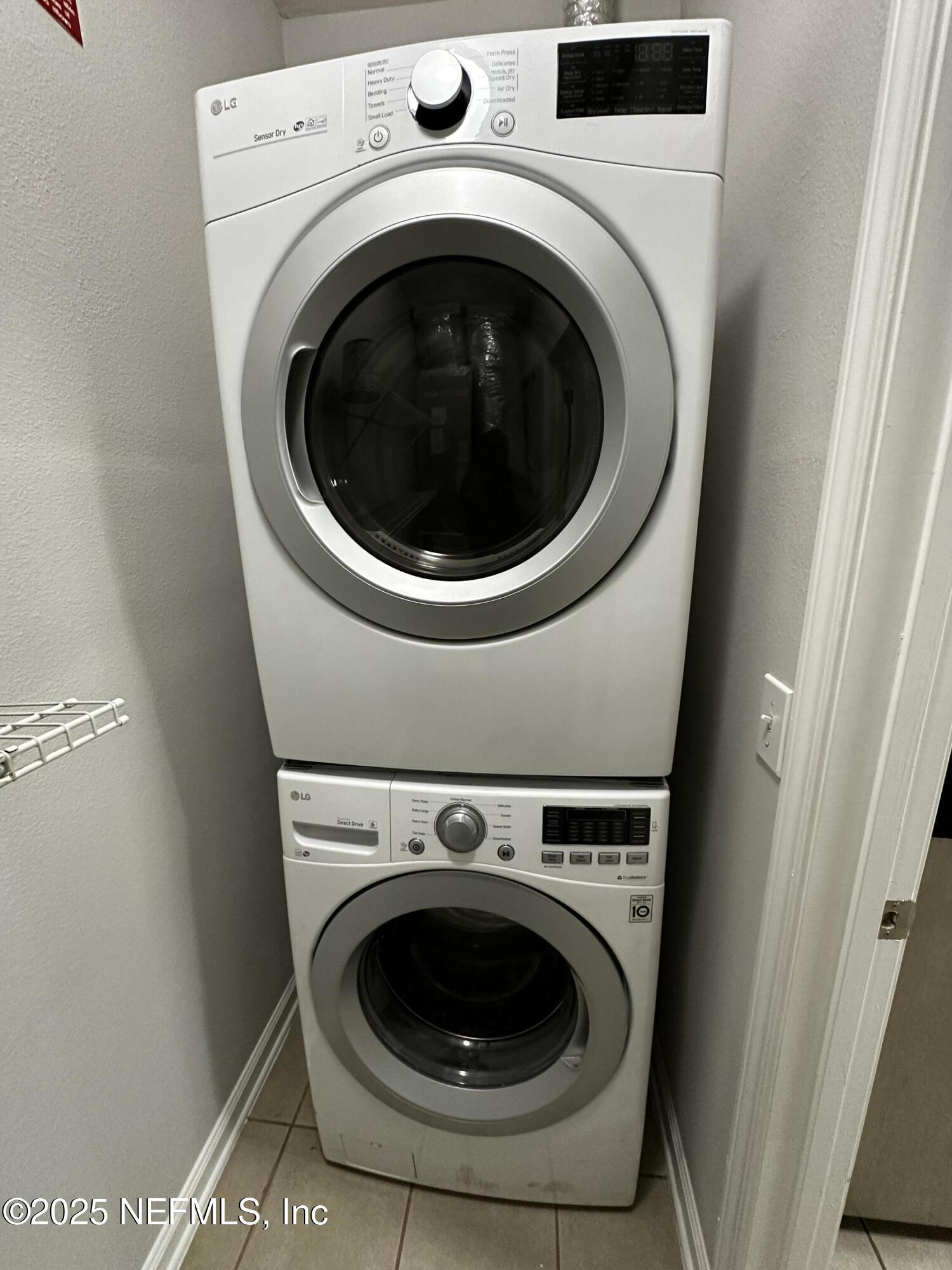 4917 Key Lime Drive, Unit 306 Jacksonville, FL 32256 - Photo 17 of 51 a utility room with dryer and washer