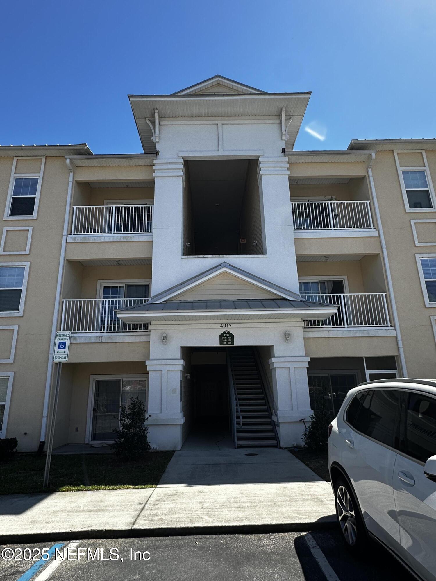 4917 Key Lime Drive, Unit 306 Jacksonville, FL 32256 - Photo 2 of 51 a front view of a house with a balcony