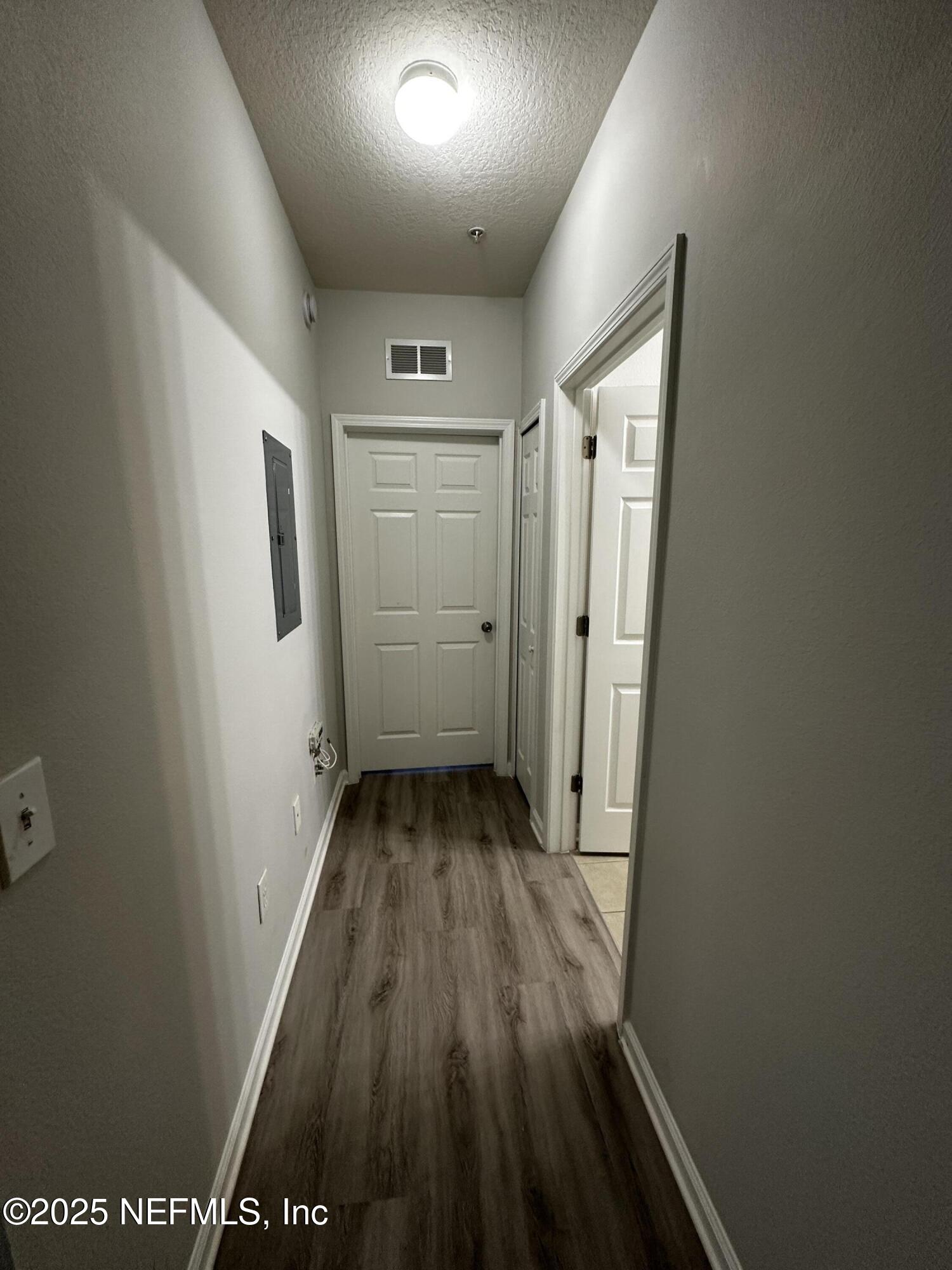 4917 Key Lime Drive, Unit 306 Jacksonville, FL 32256 - Photo 24 of 51 a view of hallway with wooden floor