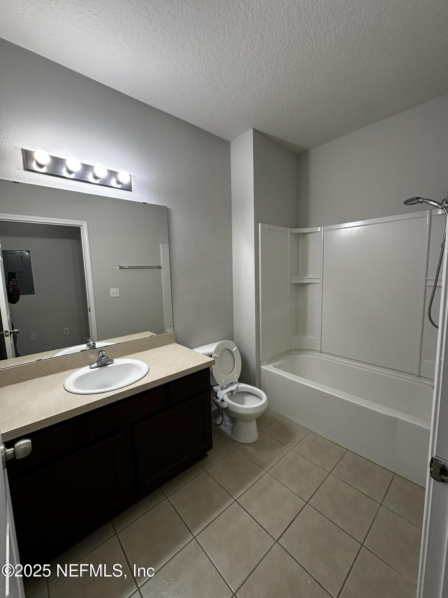 4917 Key Lime Drive, Unit 306 Jacksonville, FL 32256 - Photo 27 of 51 a bathroom with a sink toilet and shower