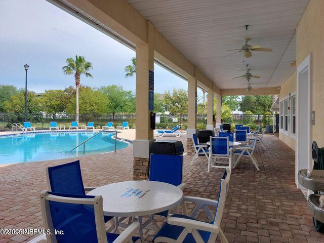 4917 Key Lime Drive, Unit 306 Jacksonville, FL 32256 - Photo 32 of 51 a view of a dining room with furniture window and outside view