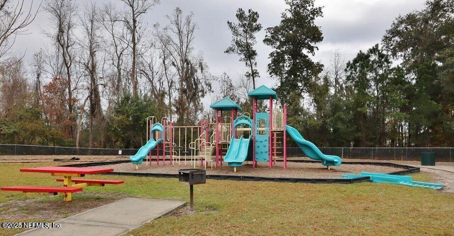 4917 Key Lime Drive, Unit 306 Jacksonville, FL 32256 - Photo 49 of 51 a view of a park with slide