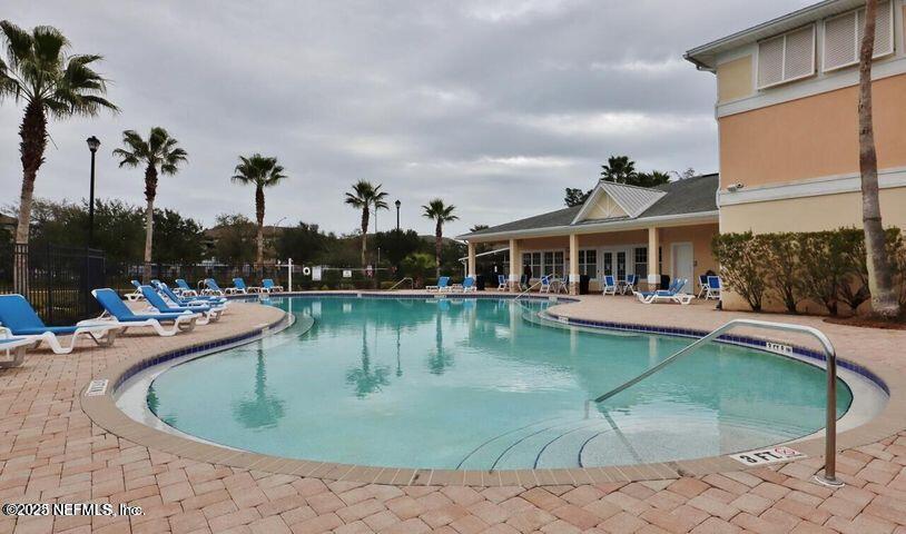 4917 Key Lime Drive, Unit 306 Jacksonville, FL 32256 - Photo 50 of 51 a view of a house with swimming pool and sitting area