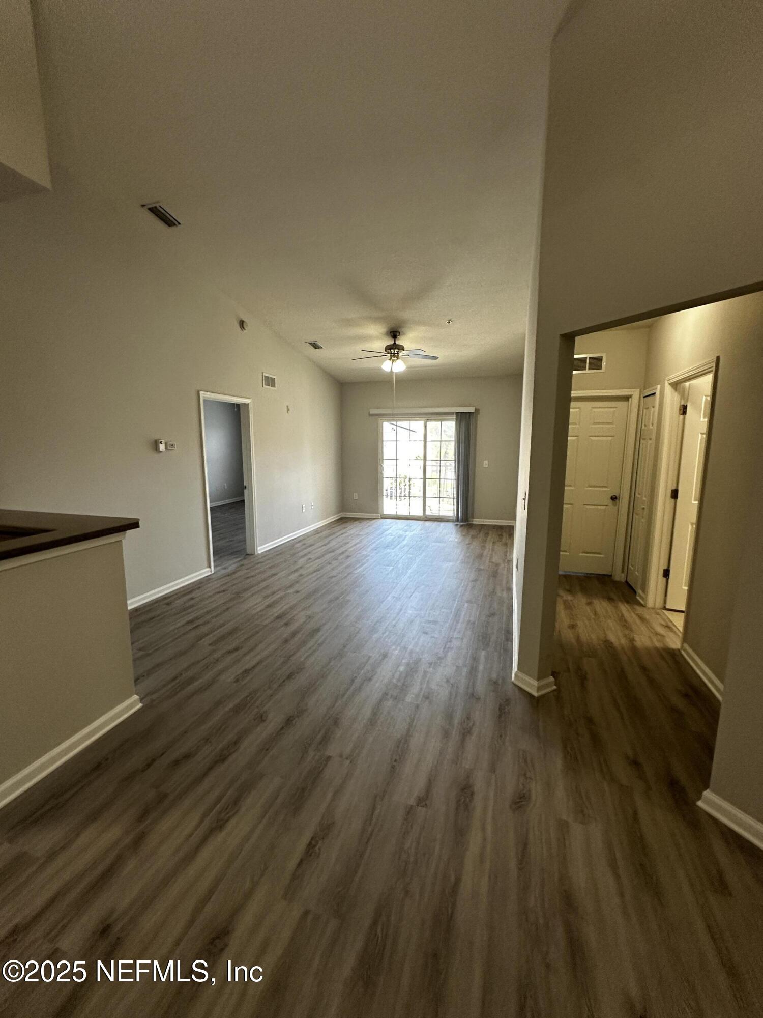 4917 Key Lime Drive, Unit 306 Jacksonville, FL 32256 - Photo 5 of 51 a view of a room with wooden floor and window