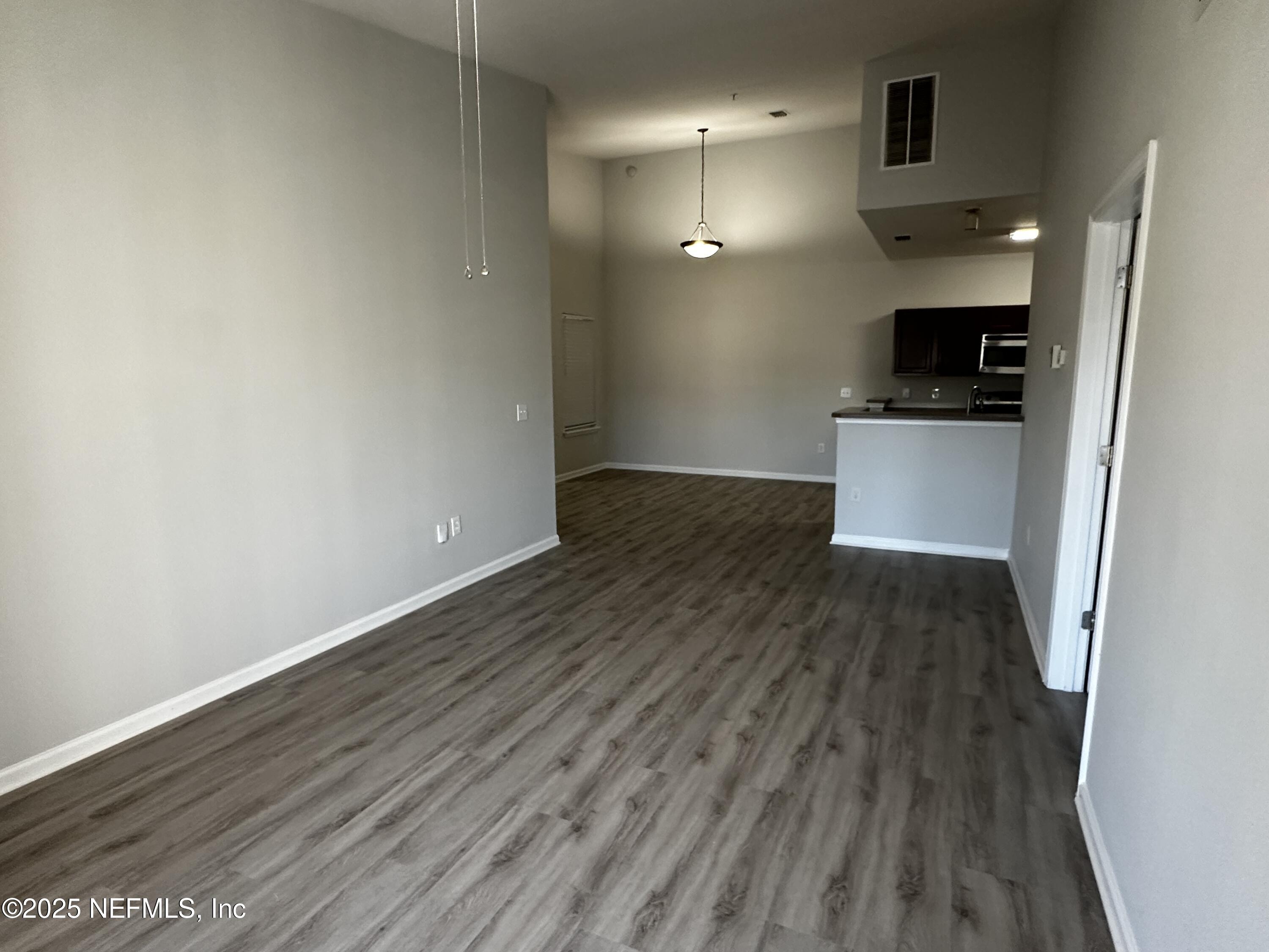 4917 Key Lime Drive, Unit 306 Jacksonville, FL 32256 - Photo 10 of 51 a view of a kitchen from the hallway