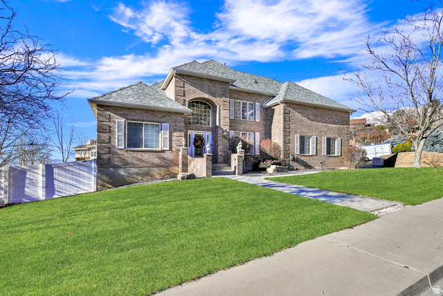 1085 Windsor Drive Provo, UT 84604 - Photo 2 of 83 French country home with brick siding and roof with shingles