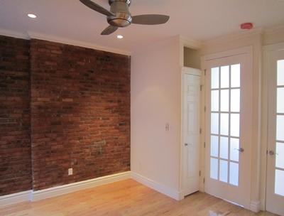 330 East 35th Street, Unit 23 Manhattan, NY 10016 - Photo 4 of 4 wooden floor in an empty room with a window