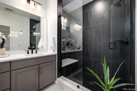 a en suite bathroom with a sink a toilet and shower