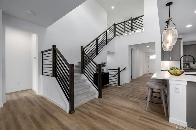 a view of entryway and hall with wooden floor