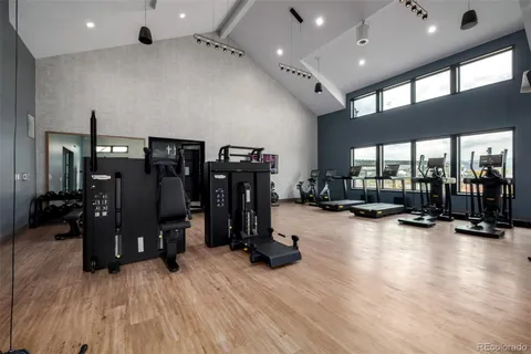 a room with gym equipment and a large window