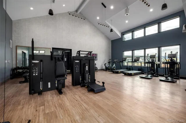 a room with gym equipment and a large window