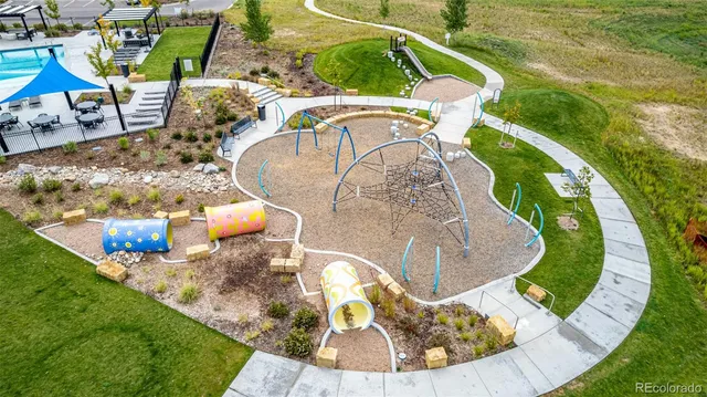 a view of a swimming pool with sitting area