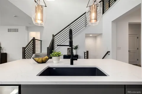 a bathroom with a sink and a large mirror