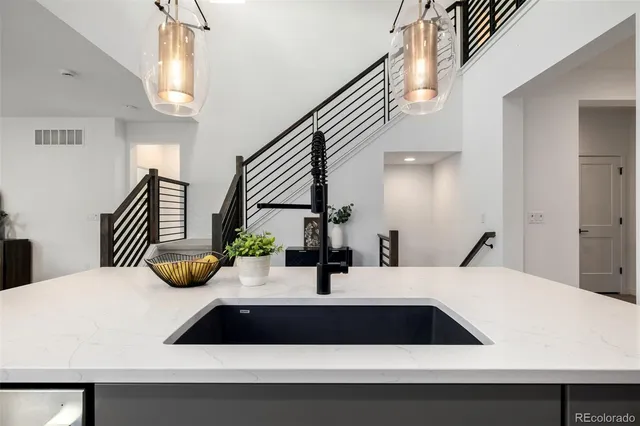 a bathroom with a sink and a large mirror