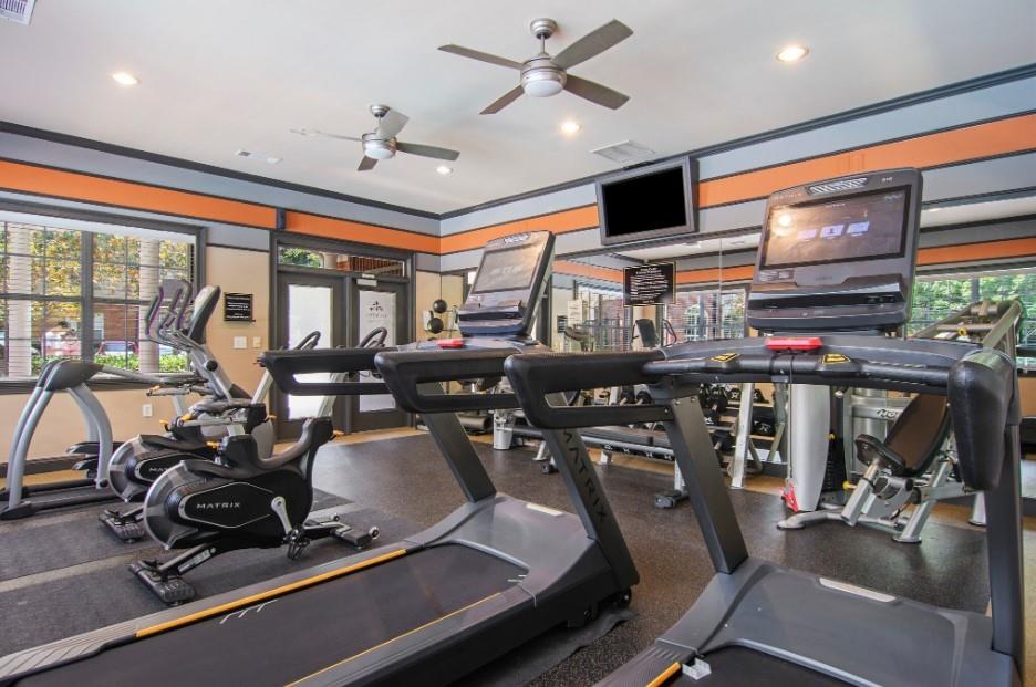 100 Ladson Court, Unit 1007 Decatur, GA 30033 - Photo 16 of 19 a room with gym equipment and a large window