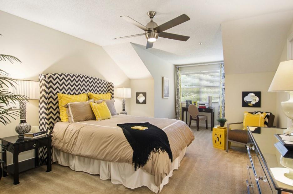 100 Ladson Court, Unit 1007 Decatur, GA 30033 - Photo 5 of 19 a bedroom with a bed and wooden floor