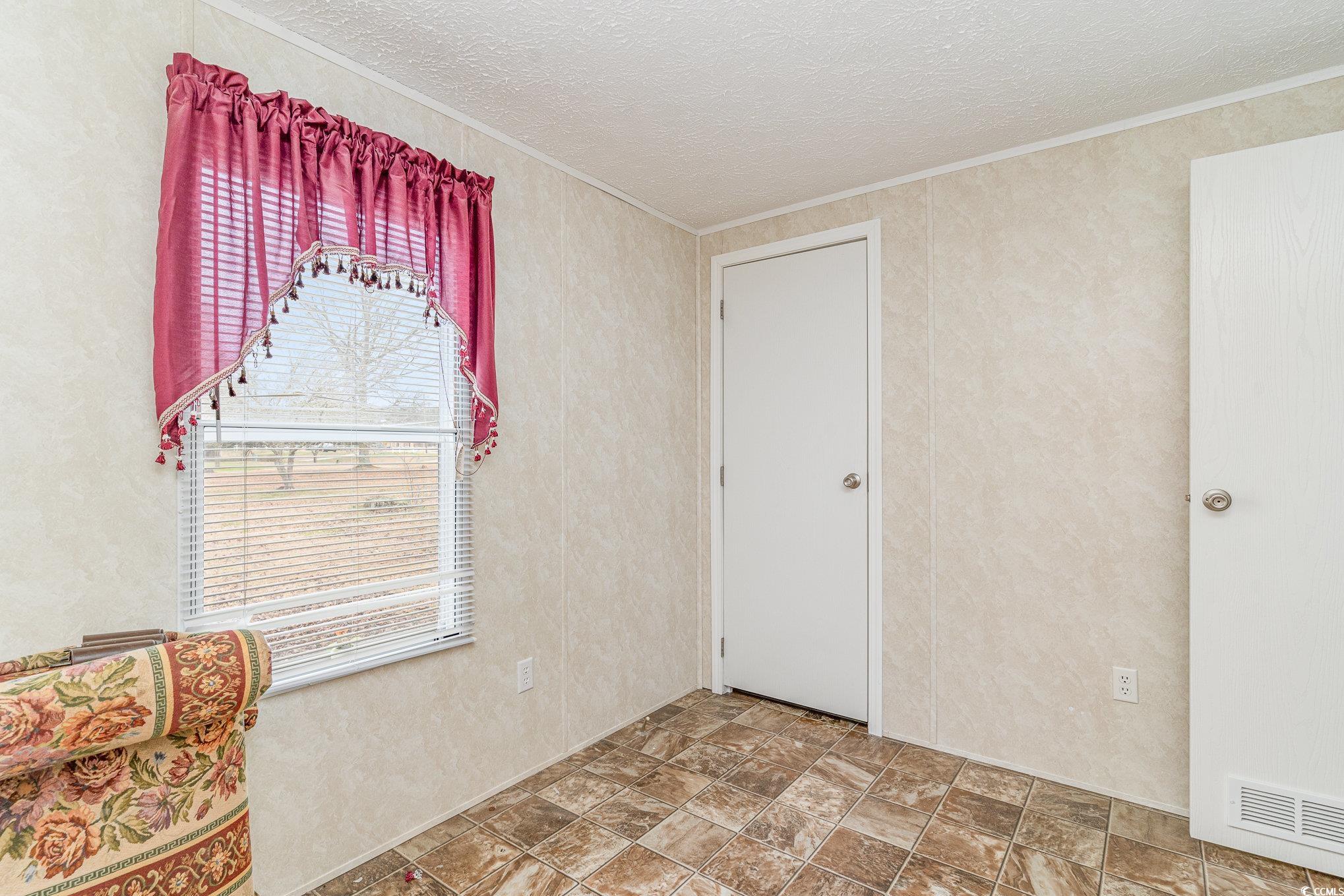16048 Choppee Road Hemingway, SC 29554 - Photo 24 of 37 Unfurnished room featuring crown molding, visible