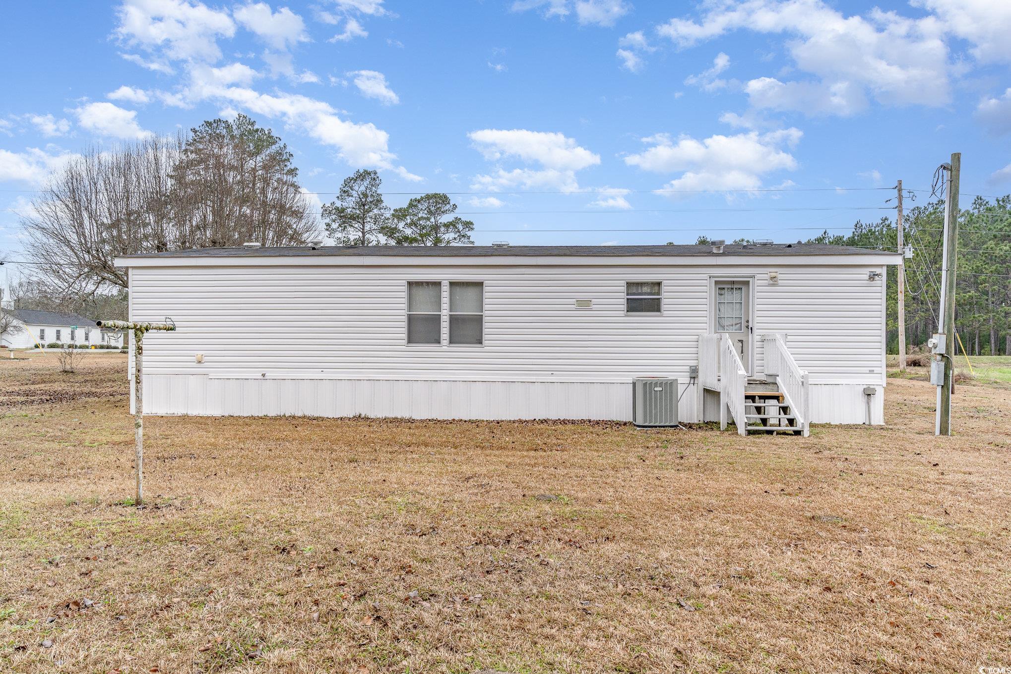 16048 Choppee Road Hemingway, SC 29554 - Photo 30 of 37 Back of house featuring central air condition unit