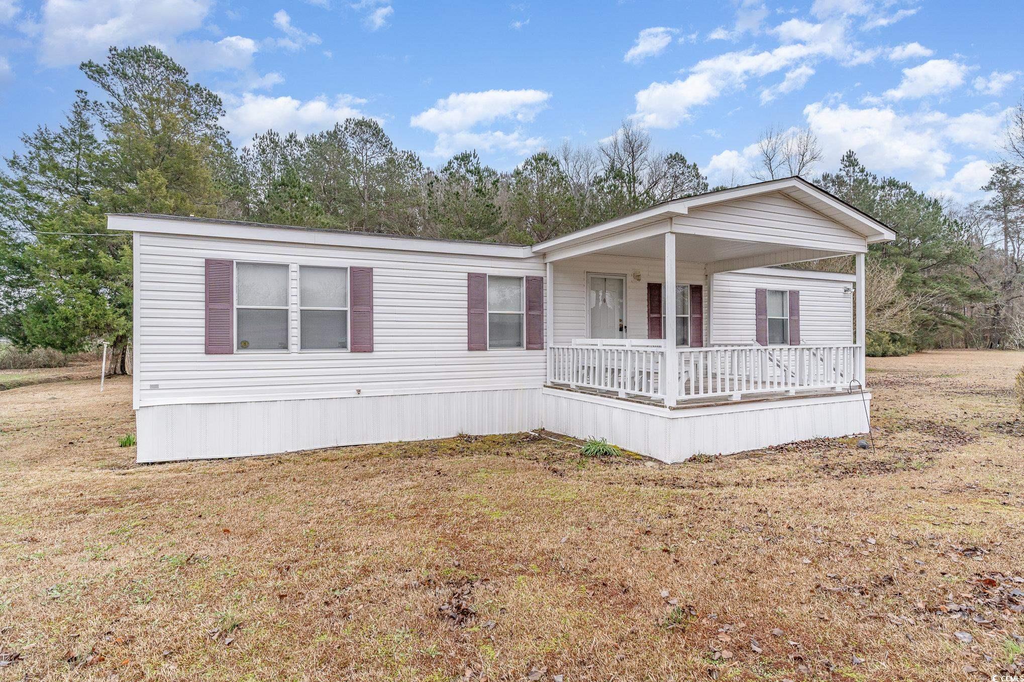 16048 Choppee Road Hemingway, SC 29554 - Photo 6 of 37 Manufactured / mobile home with covered porch and