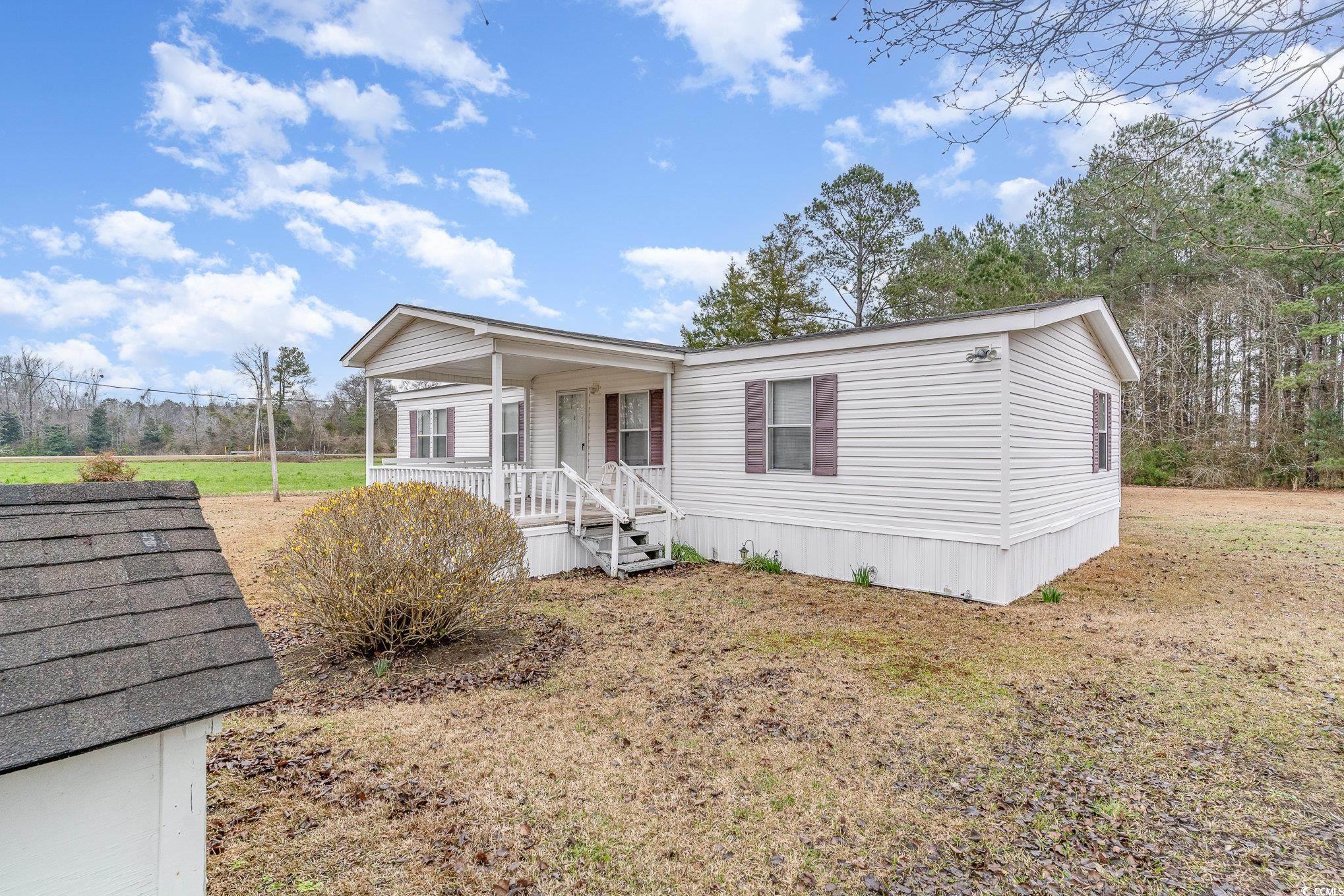 16048 Choppee Road Hemingway, SC 29554 - Photo 8 of 37 Manufactured / mobile home with covered porch and
