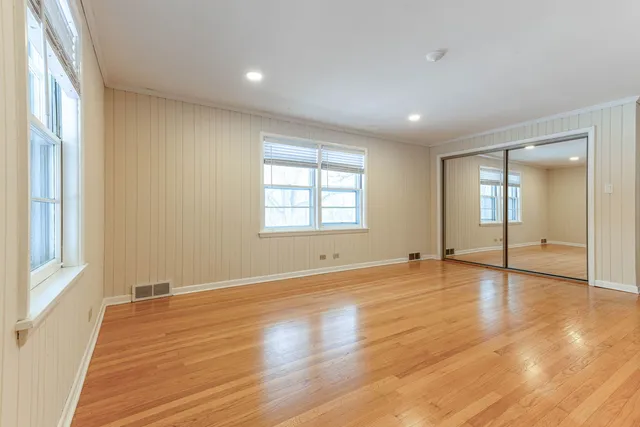 a kitchen with stainless steel appliances granite countertop a stove a sink and a wooden floors