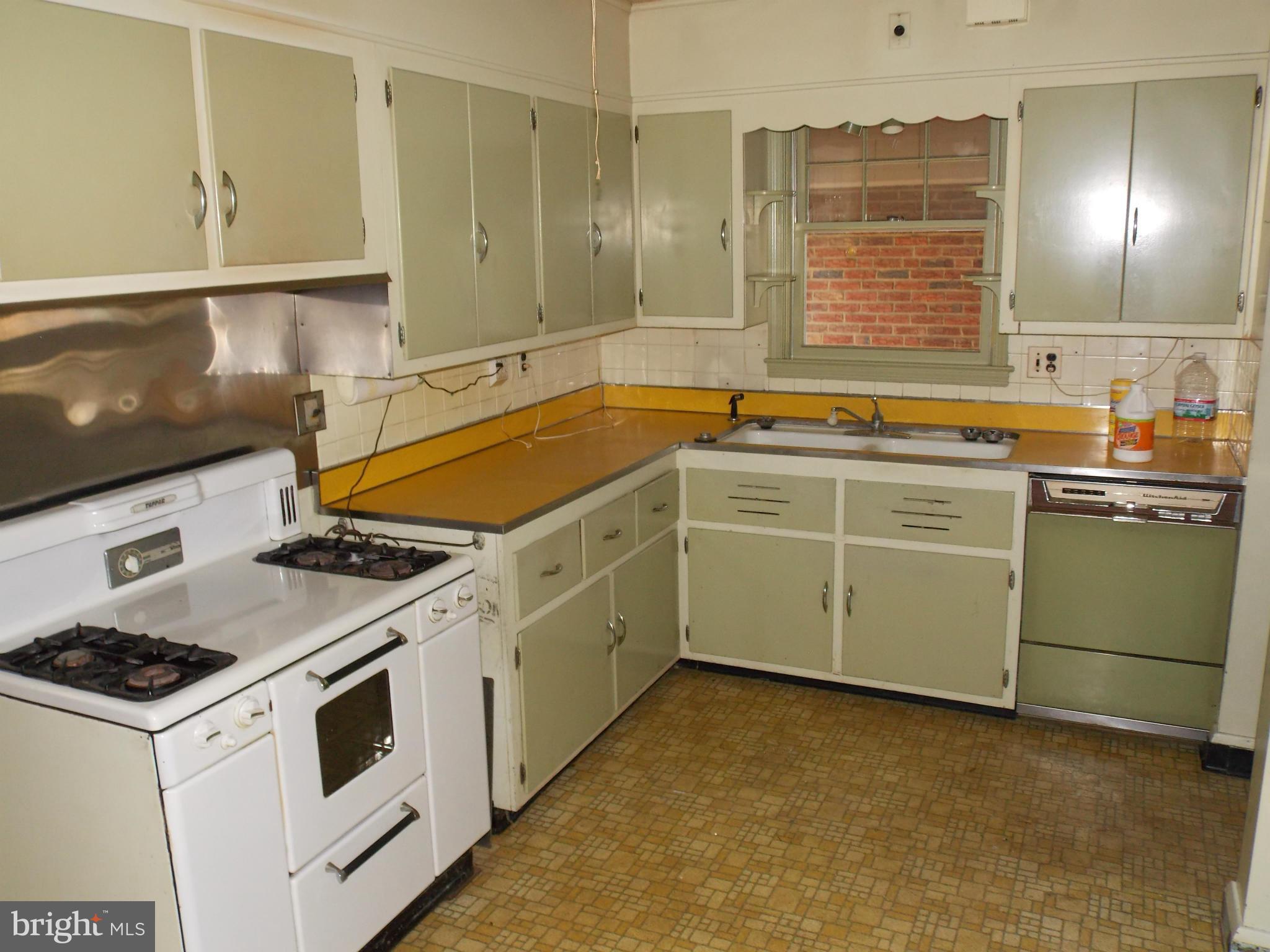 7700 Philadelphia Road Baltimore, MD 21237 - Photo 3 of 15 a kitchen with a stove and a sink