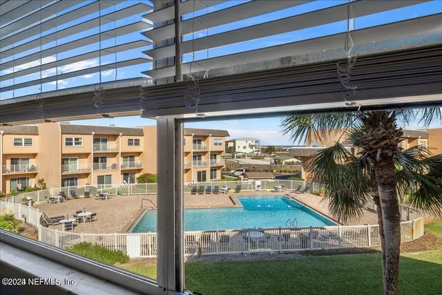 a view of swimming pool from a window