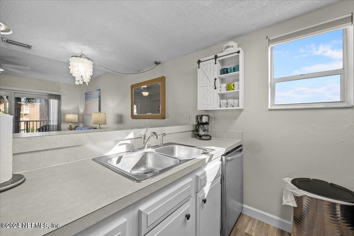 5930 Florida A1A, Unit 8E St. Augustine, FL 32080 - Photo 8 of 31 a kitchen with a sink and cabinets